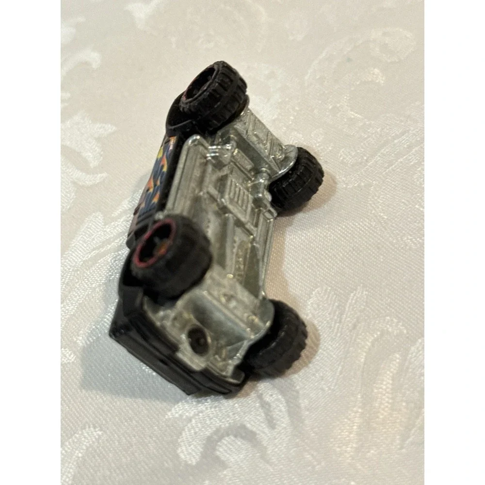 Hot Wheels Mega Duty black pickup truck, specifically the 2010 Heat Fleet